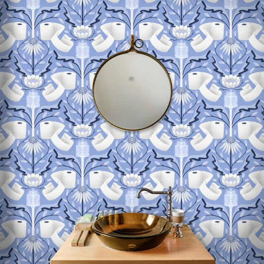 Bathroom with decorative wallpaper featuring toilet paper rolls, a round mirror, and a gold sink.