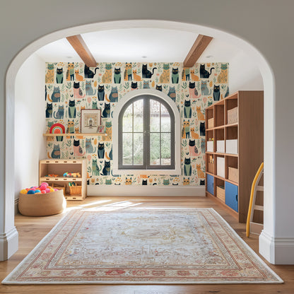Children's room with colorful cat-themed wallpaper, rug, and shelves.